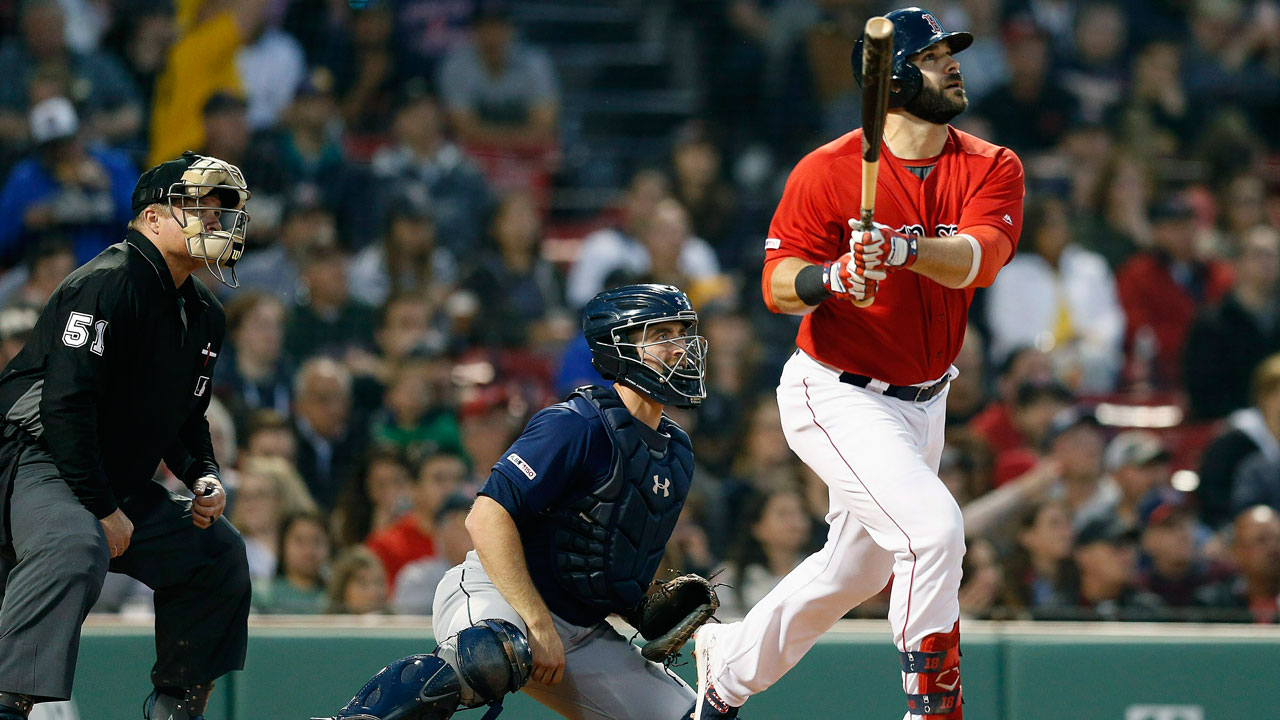 Boston Red Sox's Mitch Moreland, right, follows through on his three-run home run in front of Seattle Mariners' Tom Murphy during the third inning of a baseball game in Boston, Friday, May 10, 2019. (Michael Dwyer / AP)
