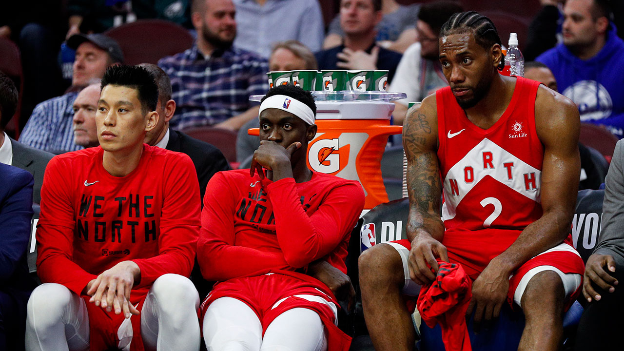 Toronto Raptors' Jeremy Lin, Pascal Siakam and Kawhi Leonard (left to right) sit on the bench during the second half of Game 6 against the 76ers in May 2019. (Chris Szagola/AP)