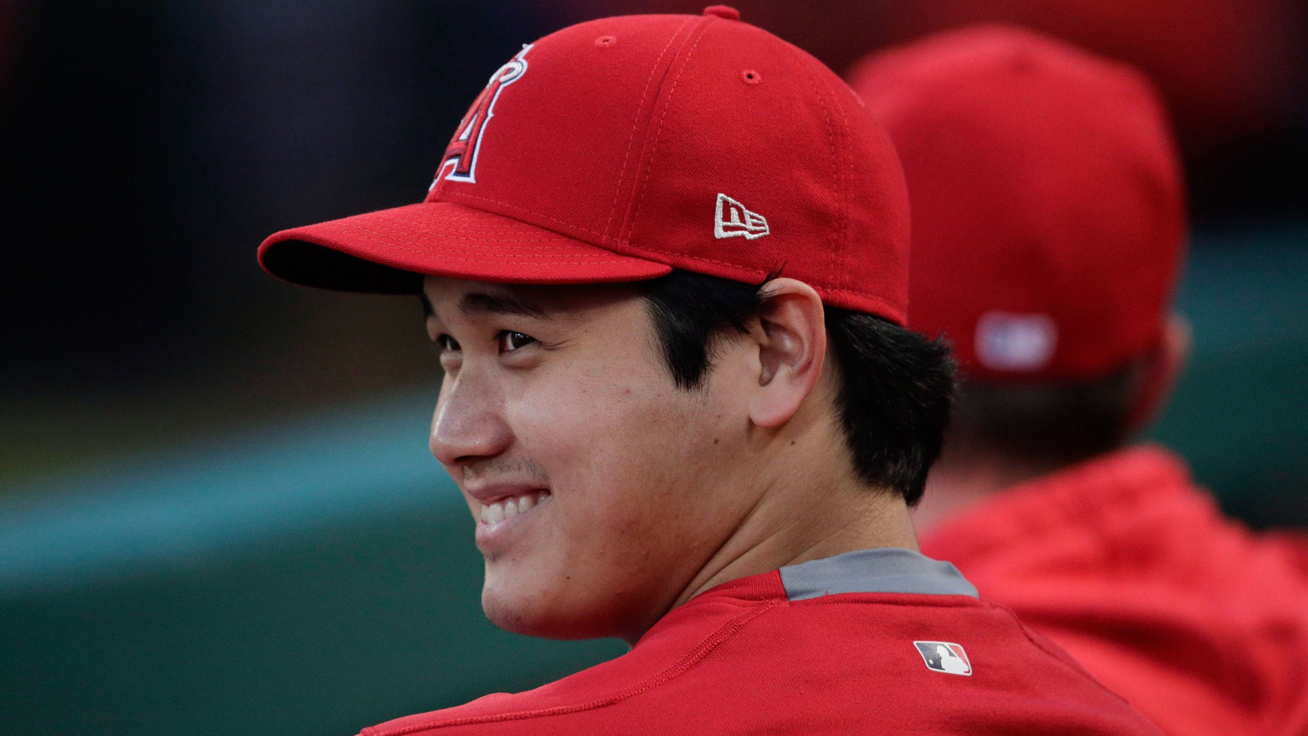 Los-Angeles-Angels'-Shohei-Ohtani,-of-Japan,-smiles-in-the-dugout-before-the-team's-baseball-game-against-the-Milwaukee-Brewers,-Wednesday,-April-10,-2019,-in-Anaheim,-Calif.-(AP-Photo/Jae-C.-Hong)