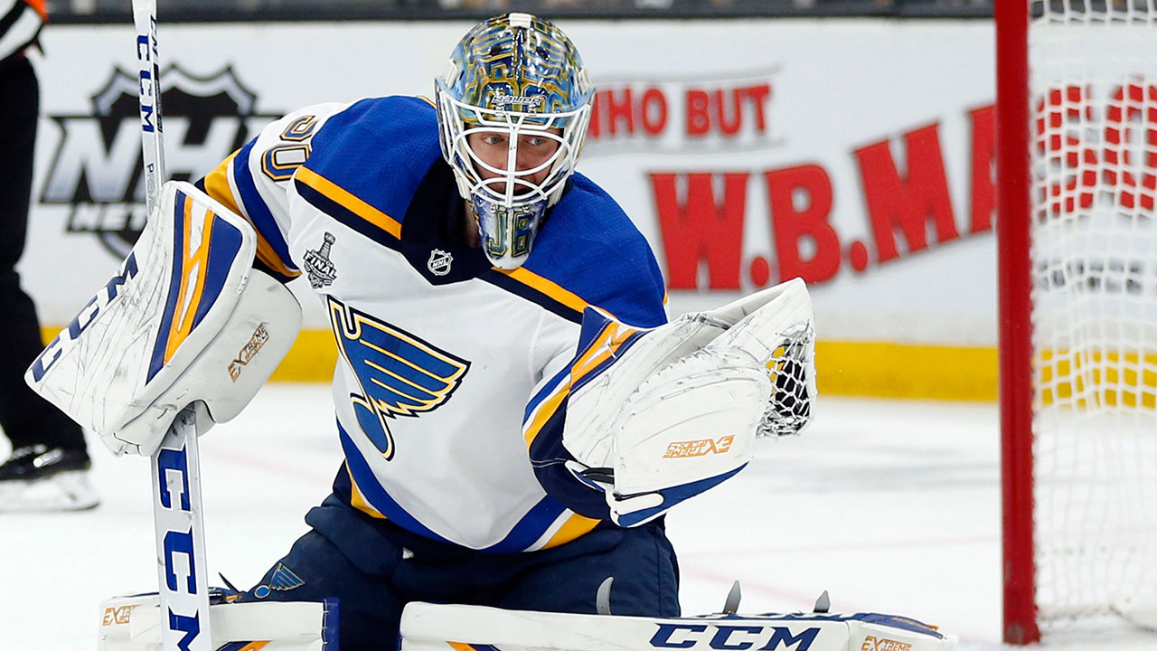 St. Louis Blues goaltender Jordan Binnington catches the puck to make a save against the Boston Bruins. (Michael Dwyer/AP)