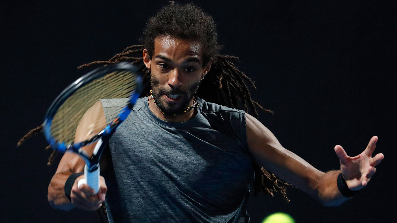 Tennis-ATP-Brown-hits-return-shot-at-Australian-Open