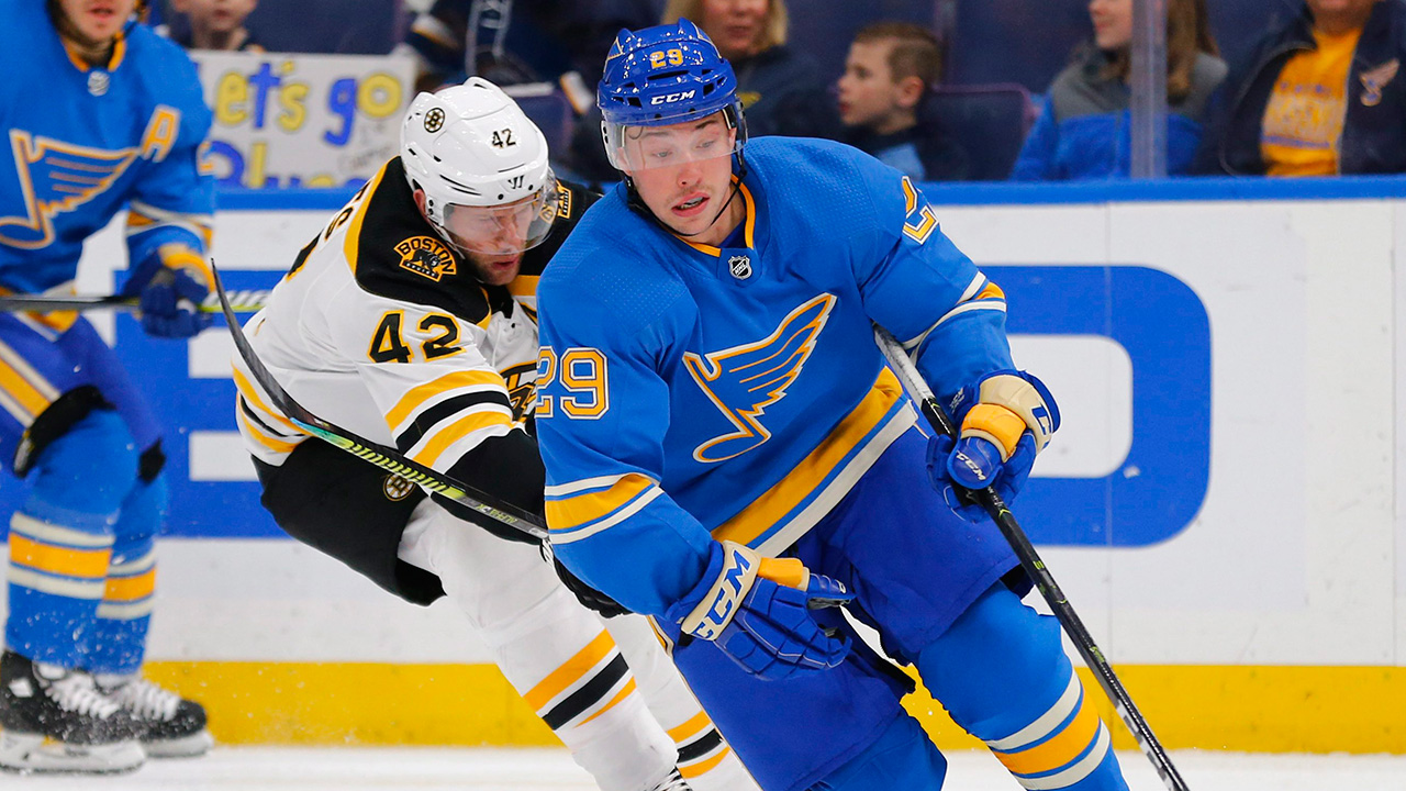 St. Louis Blues defenceman Vince Dunn (29) controls the puck against Boston Bruins winger David Backes (42). (Dilip Vishwanat/AP)