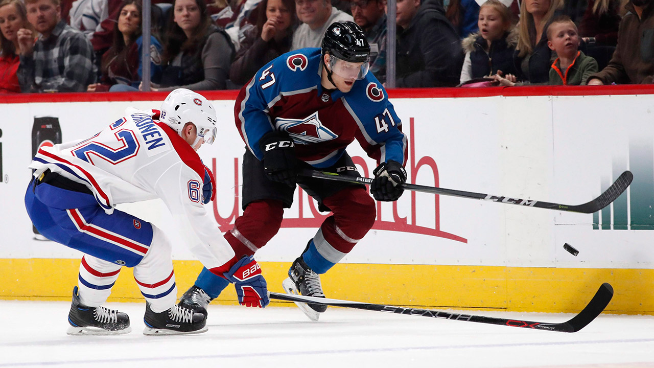 avalanche-centre-dominic-toninato-fights-for-puck-against-canadiens