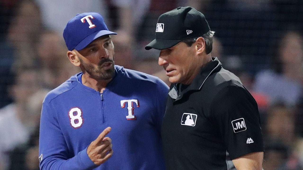 Texas Rangers manager Chris Woodward (8) argues with home plate umpire Angel Hernandez during the sixth inning of a baseball game against the Boston Red Sox at Fenway Park in Boston, Tuesday, June 11, 2019. Woodward was ejected later in the exchange. (Charles Krupa/AP)
