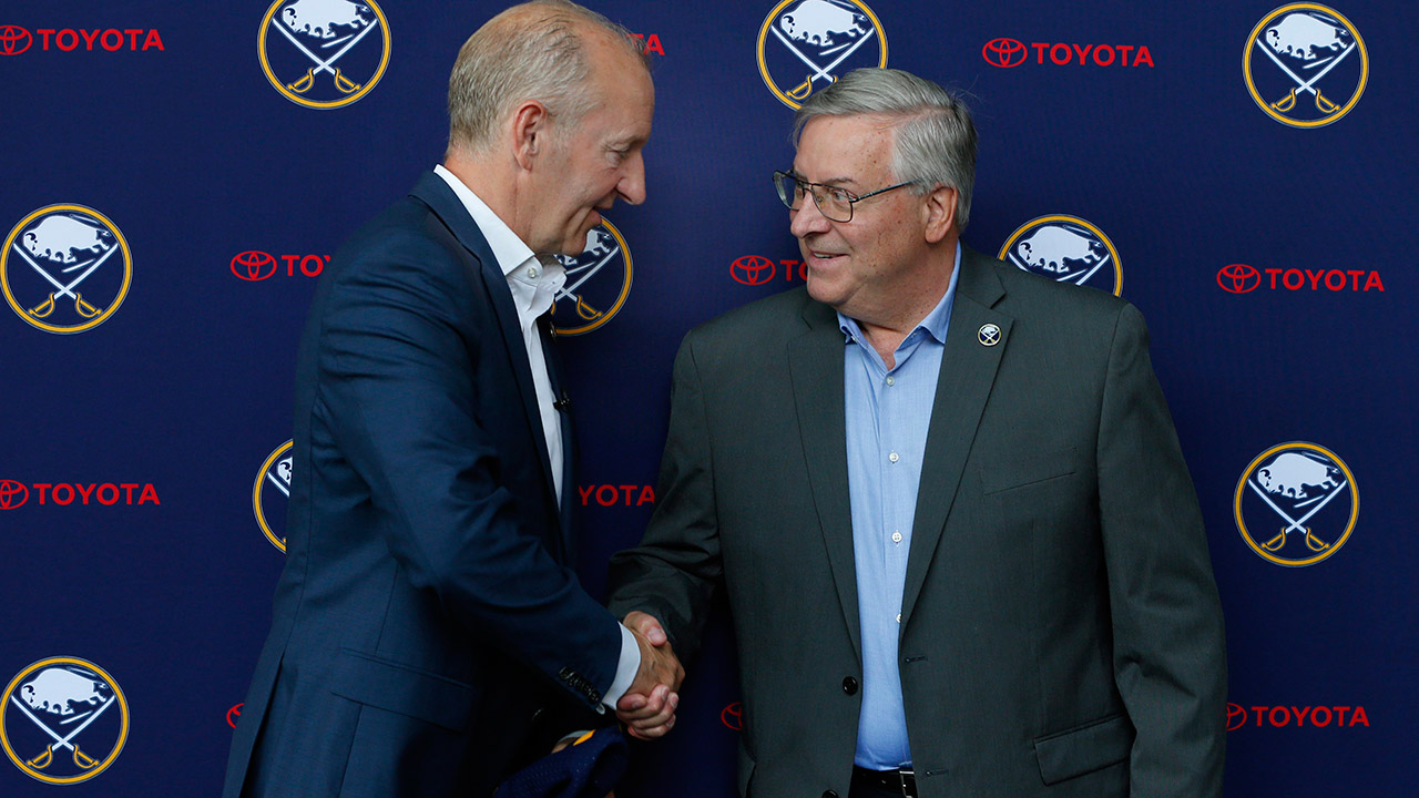 sabres-head-coach-ralph-krueger-shakes-hands-with-owner-terry-pegula