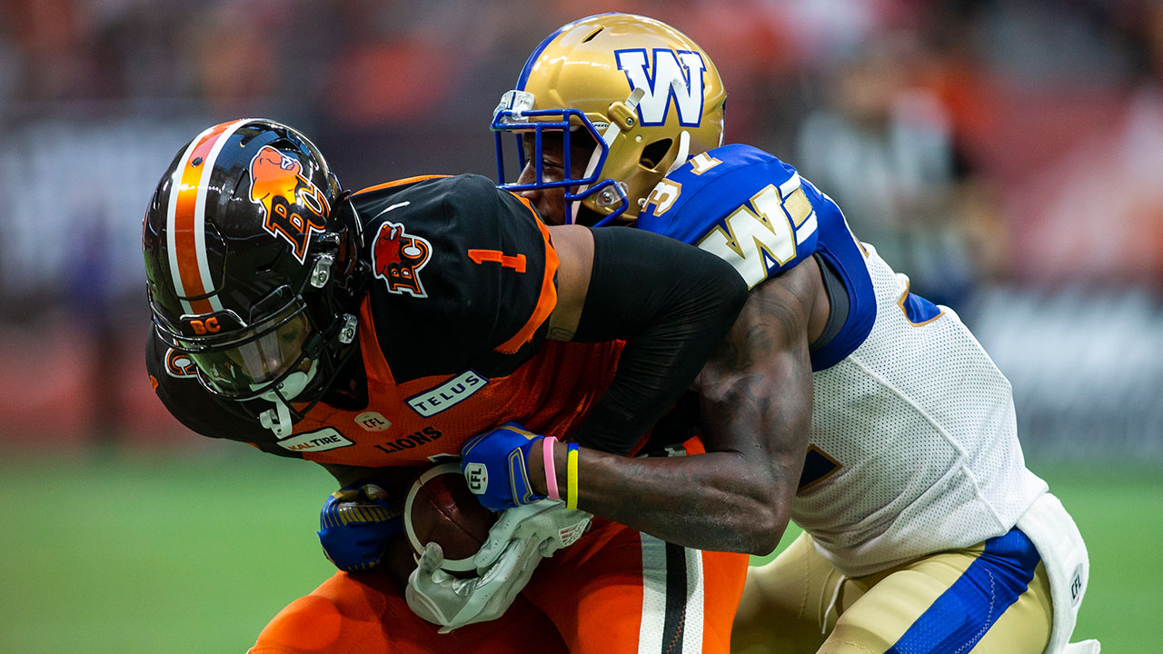 B.C. Lions' Lemar Durant (1) is tackled by Winnipeg Blue Bombers' Brandon Alexander (37). (Ben Nelms/CP)