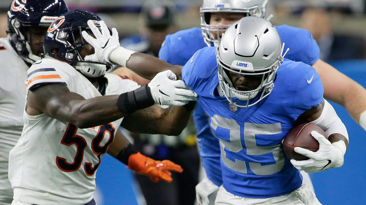NFL-Lions-Riddick-stiff-arms