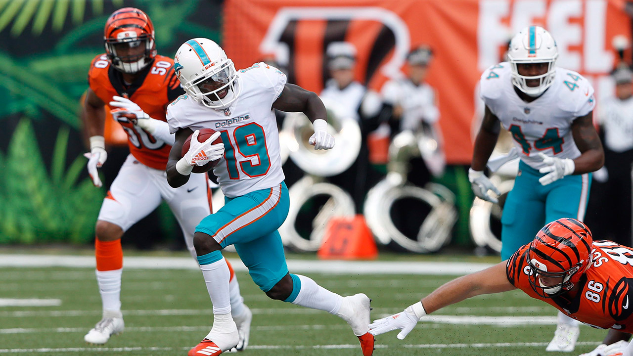 dolphins-jakeem-grant-runs-with-football-against-dolphins