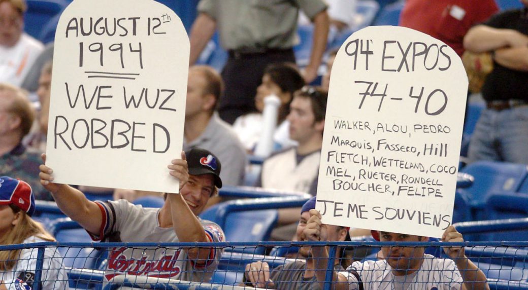 Two-Montreal-Expos-fans-remember-the-strike-of-1994-before-the-game-between-the-Expos-and-the-Arizona-Diamondbacks-during-NL-action,-Thursday,-Aug.-12,-2004-in-Montreal.-(CP-PHOTO/Francois-Roy)