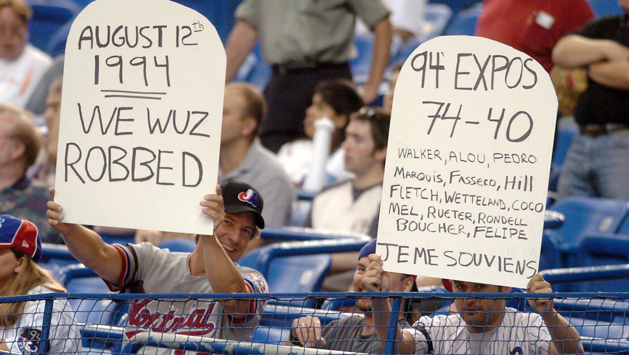 Two-Montreal-Expos-fans-remember-the-strike-of-1994-before-the-game-between-the-Expos-and-the-Arizona-Diamondbacks-during-NL-action,-Thursday,-Aug.-12,-2004-in-Montreal.-(CP-PHOTO/Francois-Roy)