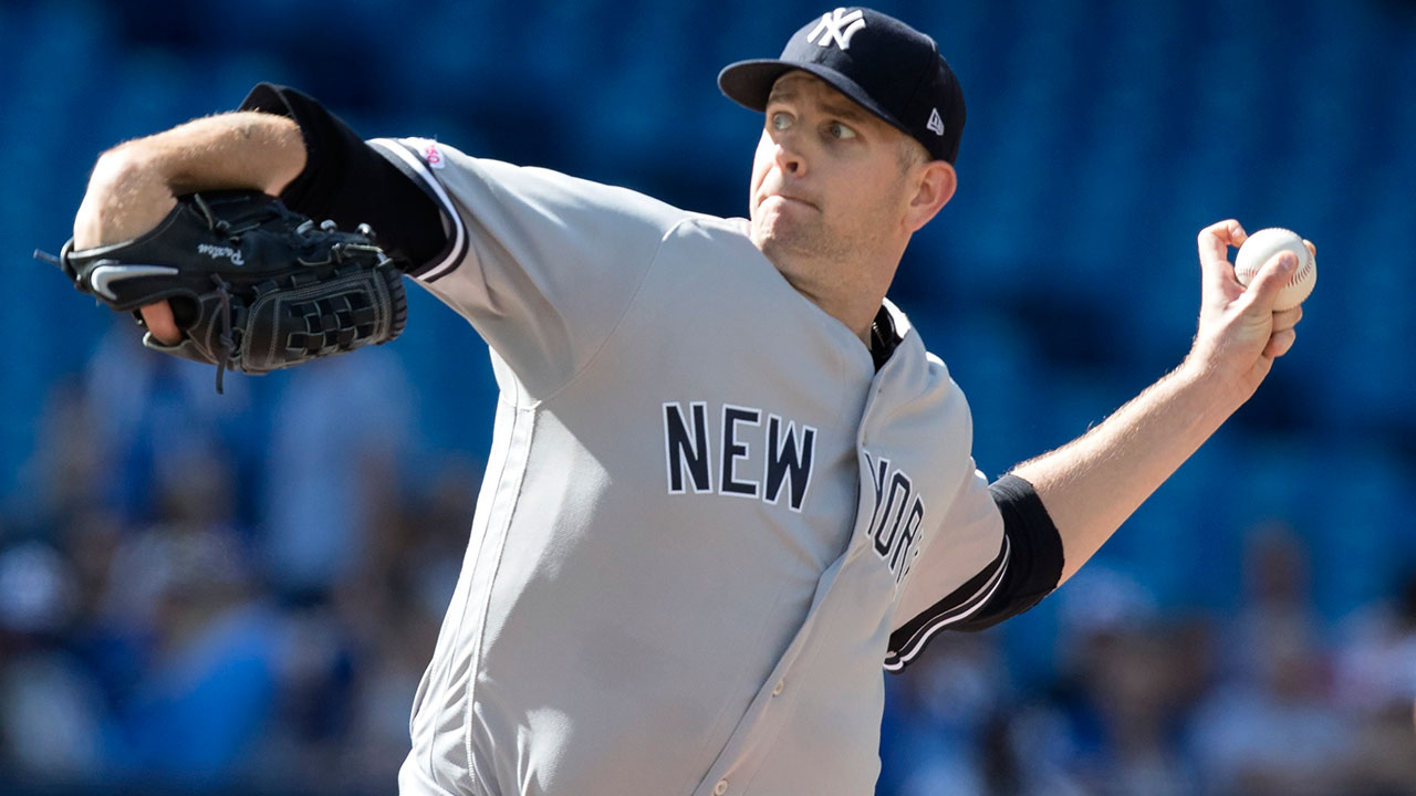 New York Yankees' Gleyber Torres, right, is met by teammate Luke Voit after hitting a two run home run against the Toronto Blue Jays in the sixth inning of their American League MLB baseball game in Toronto on Saturday, September 14, 2019. (Fred Thornhill / CP)