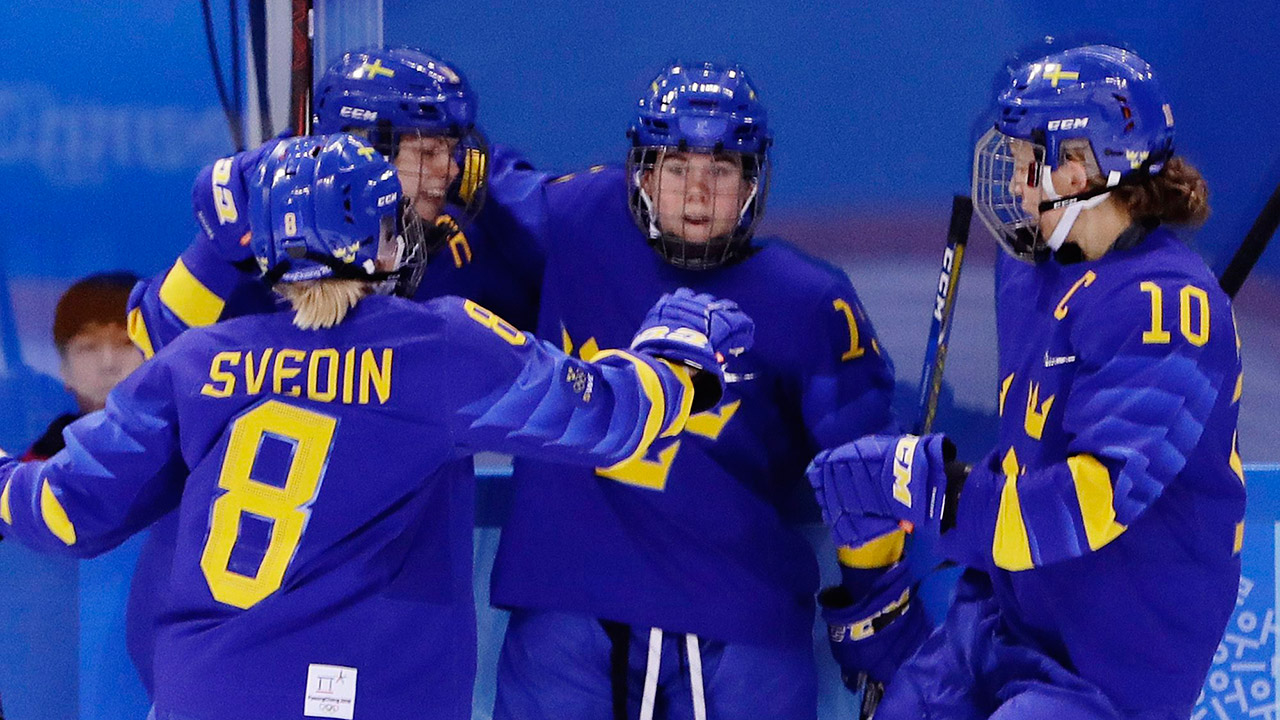 players-from-swedens-womens-hockey-team-celebrate-goal-at-olympics