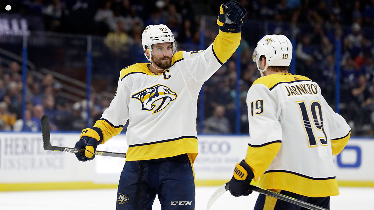 Nashville Predators defenseman Roman Josi (59) celebrates his goal against the Tampa Bay Lightning with centre Calle Jarnkrok (19) during the third period of in Saturday, Oct. 26, 2019, in Tampa, Fla. (Chris O'Meara / AP)