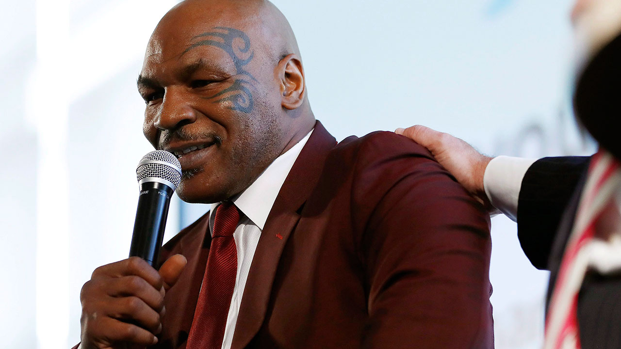 mike-tyson-speaks-into-microphone