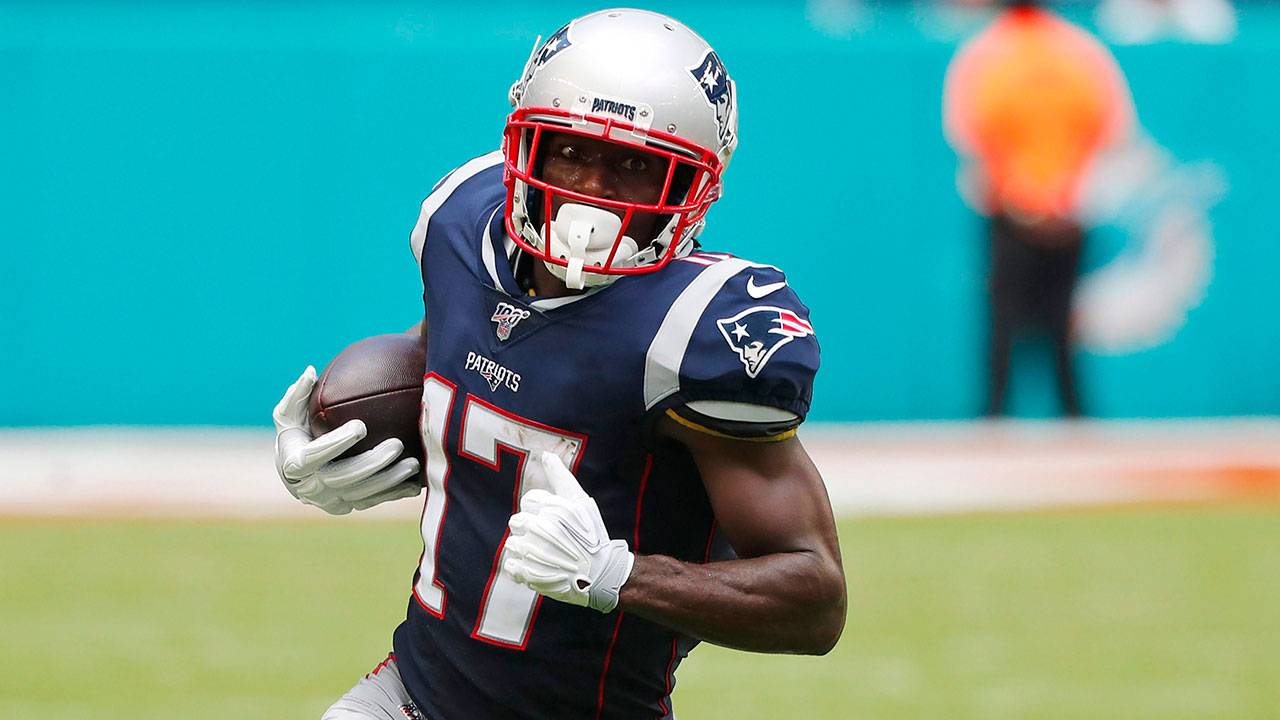 New England Patriots wide receiver Antonio Brown (17) carries the ball during the first half at an NFL football game against the Miami Dolphins. (Wilfredo Lee, File, AP)