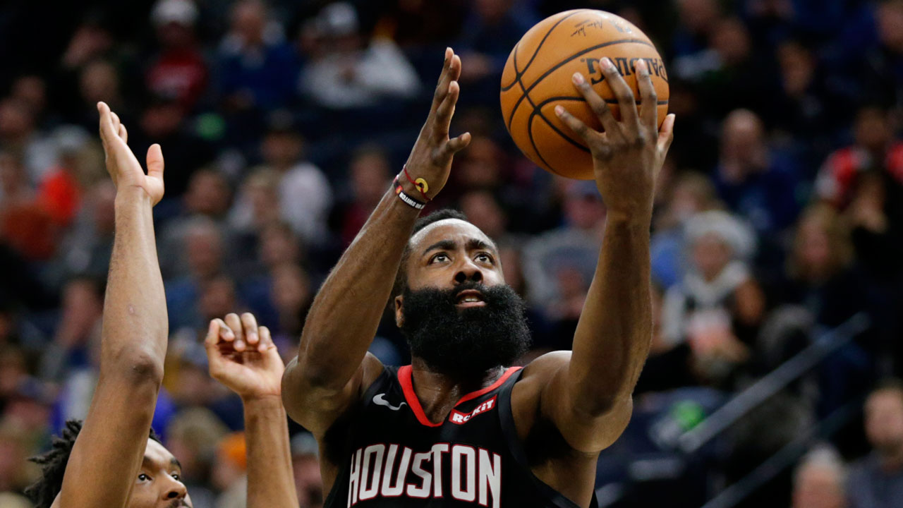 Houston Rockets guard James Harden (13) shoots on against Minnesota Timberwolves guard Keita Bates-Diop in the third quarter during an NBA basketball game. (Andy Clayton- King/AP)