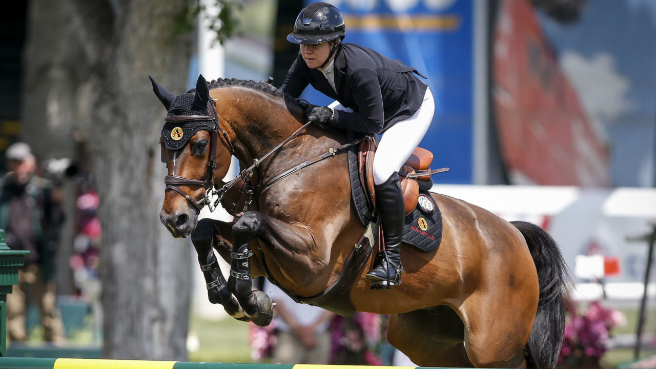 Canada's Nicole Walker rides Falco van Spieveld, during the Grand Prix event of the National at Spruce Meadows. (Jeff McIntosh/CP)