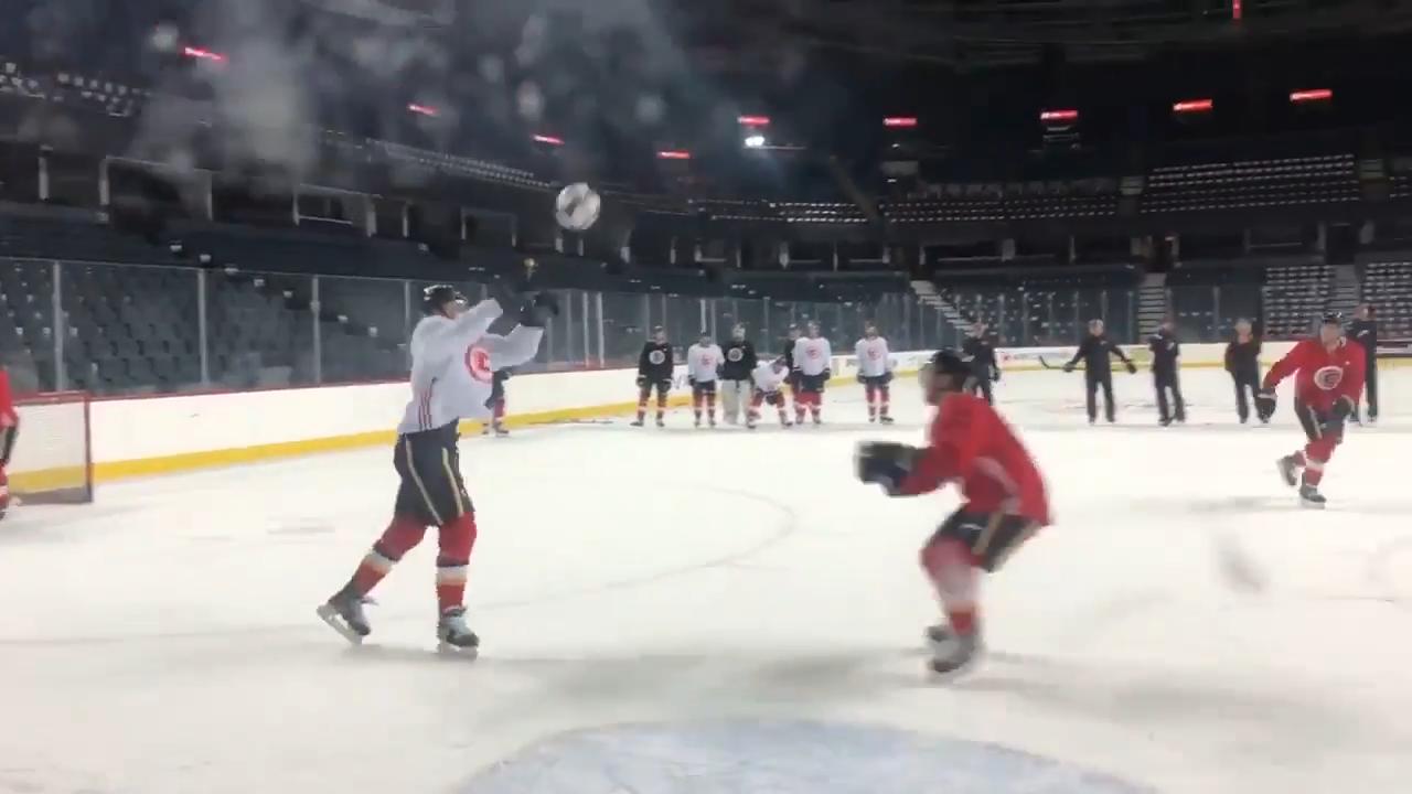 Flames having a blast at practice, playing a little ice handball
