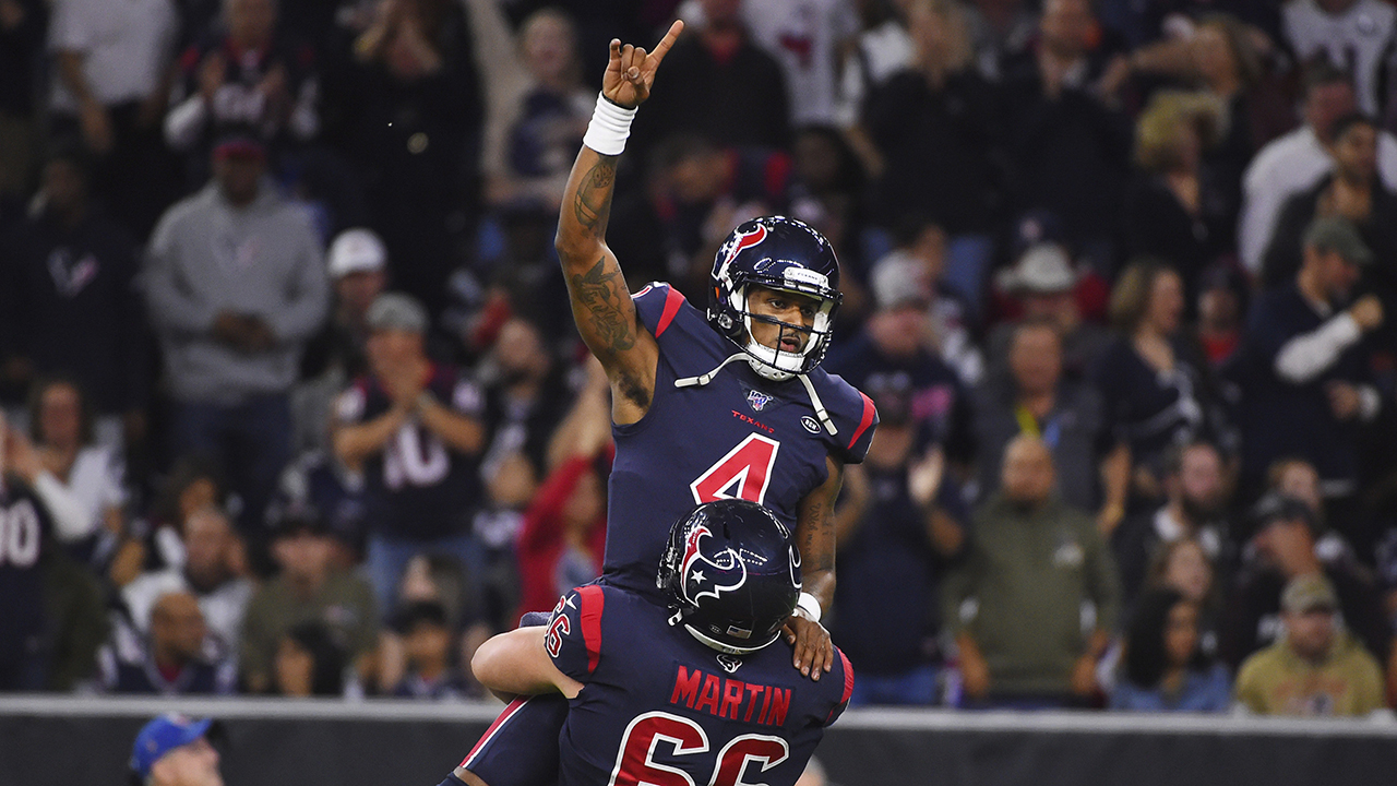 Houston Texans quarterback Deshaun Watson (4) is lifted by center Nick Martin (66) as they celebrate a touchdown against the New England Patriots on Sunday, Dec. 1, 2019, in Houston. (Eric Christian Smith/AP)