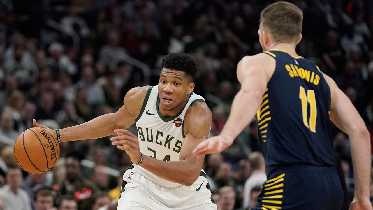 Milwaukee Bucks' Giannis Antetokounmpo tries to get past Indiana Pacers' Domantas Sabonis during the second half of an NBA basketball game. (Morry Gash/AP)