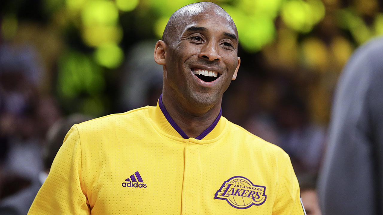 Los Angeles Lakers forward Kobe Bryant smiles to the crowd during a ceremony before his last NBA basketball game. (Jae C. Hong/AP)
