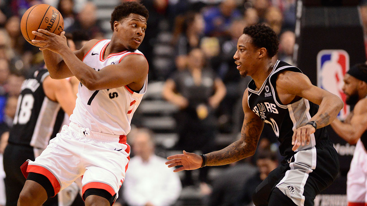 Toronto Raptors guard Kyle Lowry (7) controls the ball as former teammate San Antonio Spurs guard DeMar DeRozan (10) defends during first half NBA basketball action in Toronto on Friday, Feb. 22, 2019. (Frank Gunn / CP)