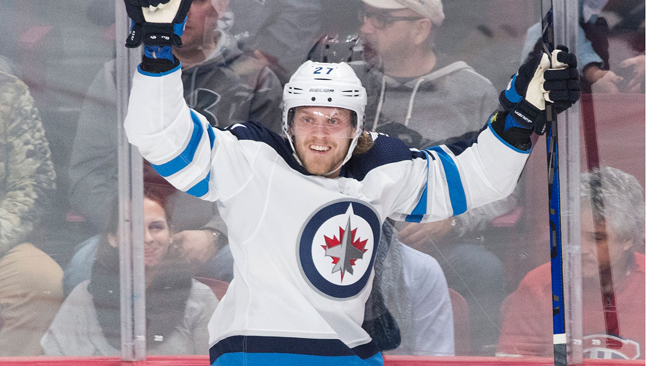 Winnipeg Jets' Nikolaj Ehlers celebrates after scoring against the Montreal Canadiens during second period NHL hockey action against the Montreal Canadiens in Montreal, Monday, January 6, 2020. (Graham Hughes/CP)