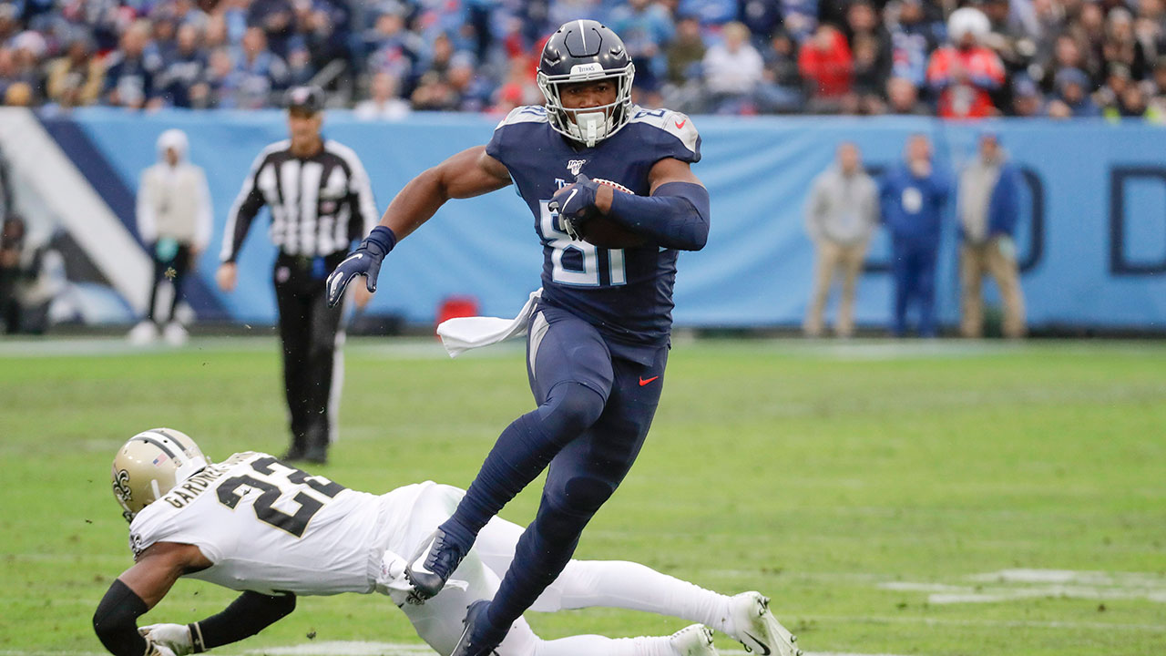 Tennessee Titans tight end Jonnu Smith (81) gets past New Orleans Saints defensive back Chauncey Gardner-Johnson (22) as Smith scores a touchdown in the first half of an NFL football game Sunday. (James Kenney/AP)