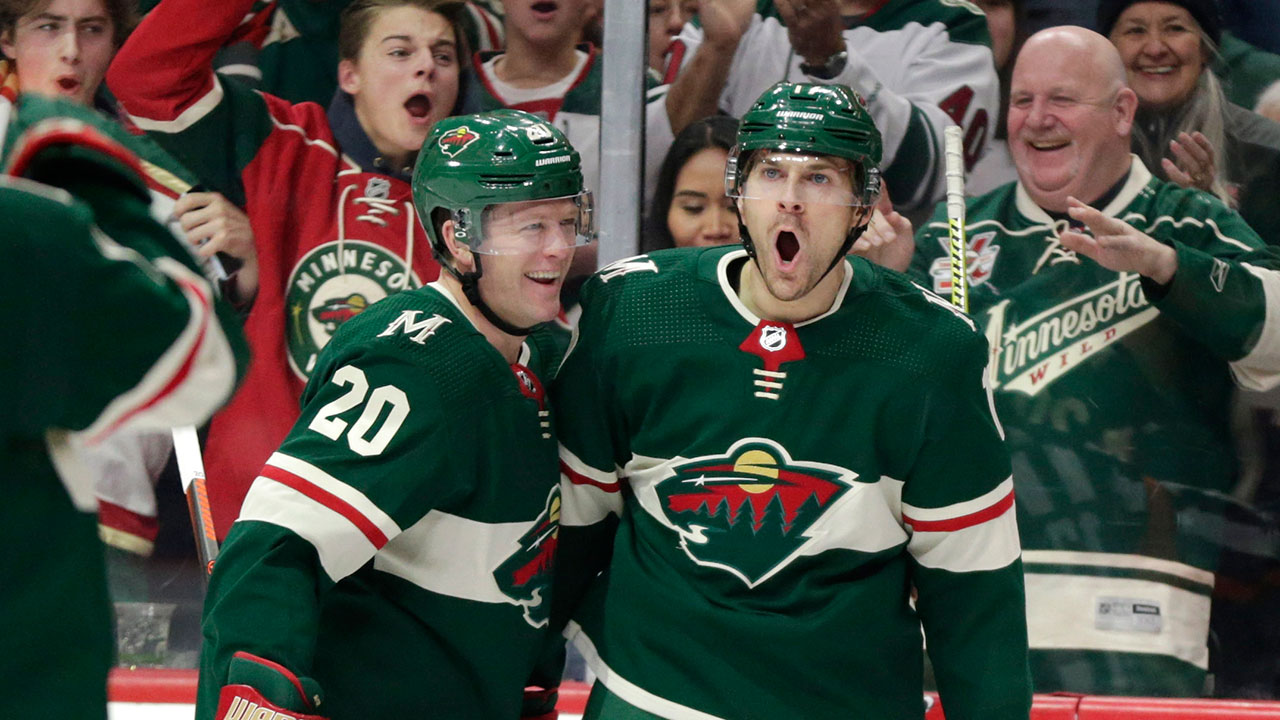 Minnesota Wild left wing Marcus Foligno (17) celebrates defenseman Ryan Suter (2) after scoring a goal against the Winnipeg Jets. (Andy Clayton-King/AP)