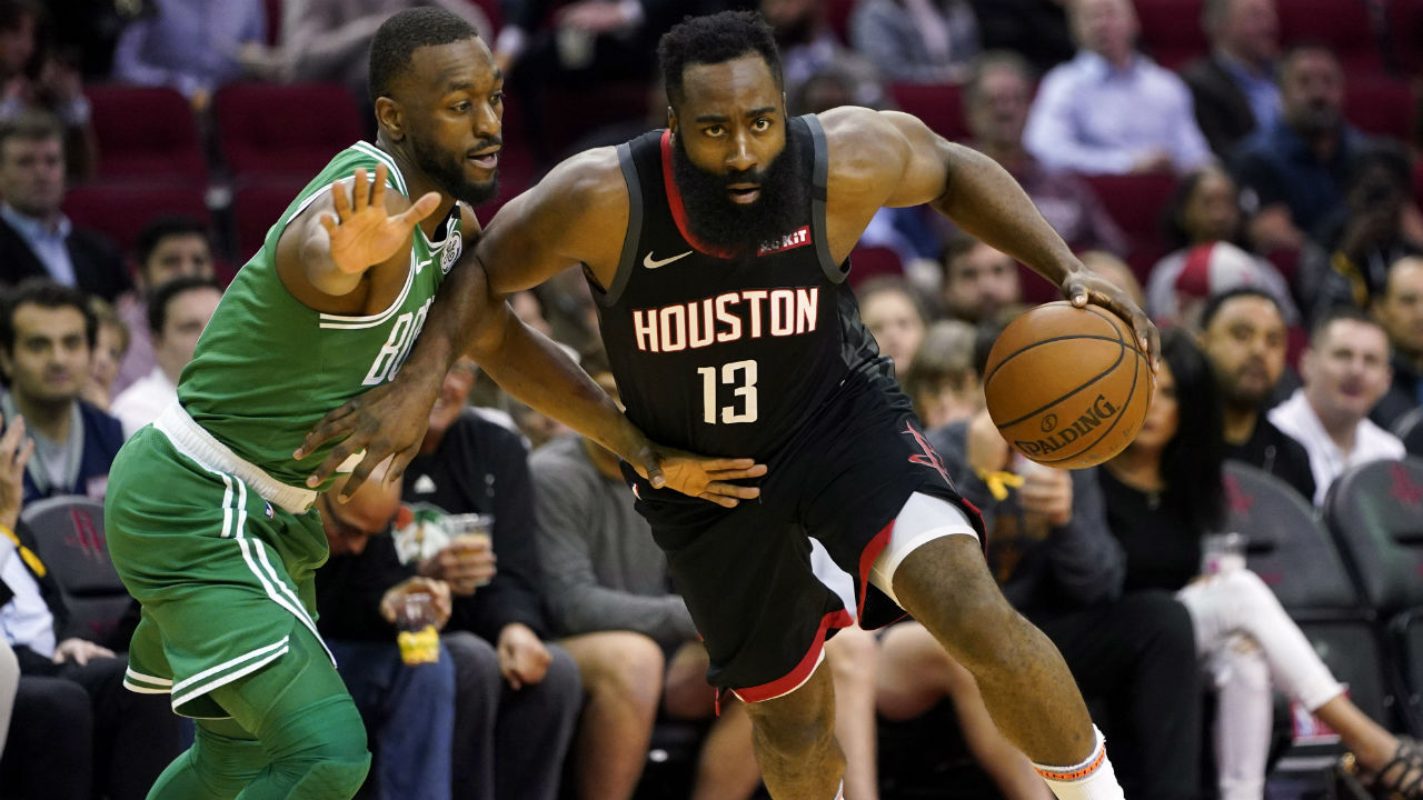 Houston Rockets' James Harden (13) drives toward the basket as Boston Celtics' Kemba Walker defends. (David J. Phillip/AP)
