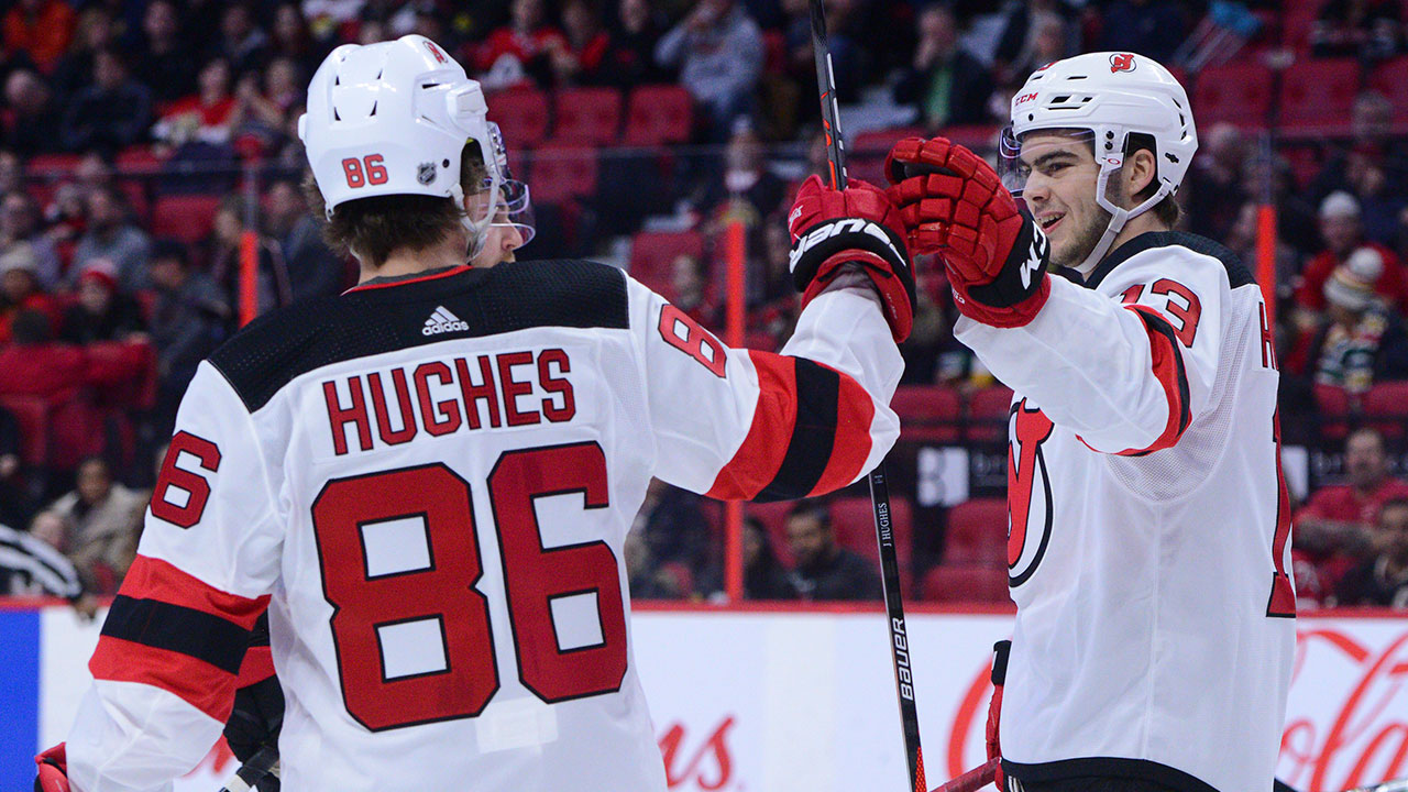 New-Jersey-Devils-centre-Nico-Hischier-celebrates-a-goal-with-Jack-Hughes