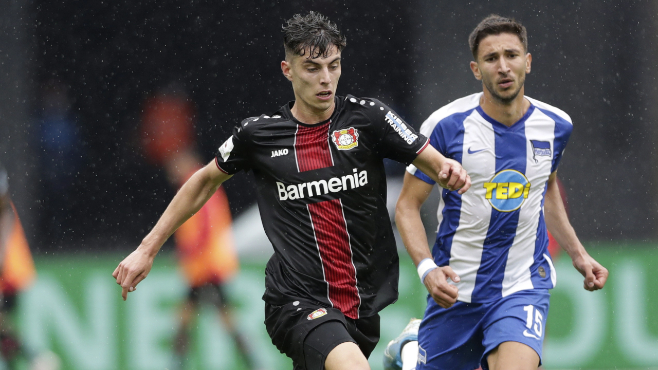 Berlin's Marko Grujic, right, and Leverkusen's Kai Havertz challenge for the ball during a Bundesliga match between Hertha BSC Berlin and Bayer Leverkusen in Berlin, Germany, Saturday, June 20, 2020. (Michael Sohn/AP)