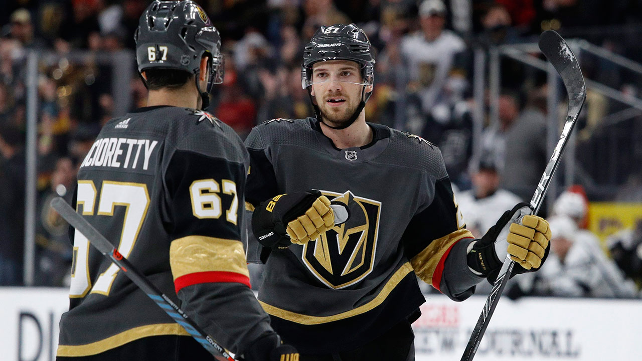 Vegas Golden Knights defenceman Shea Theodore, right, celebrates after scoring against the Los Angeles Kings. (John Locher/AP)