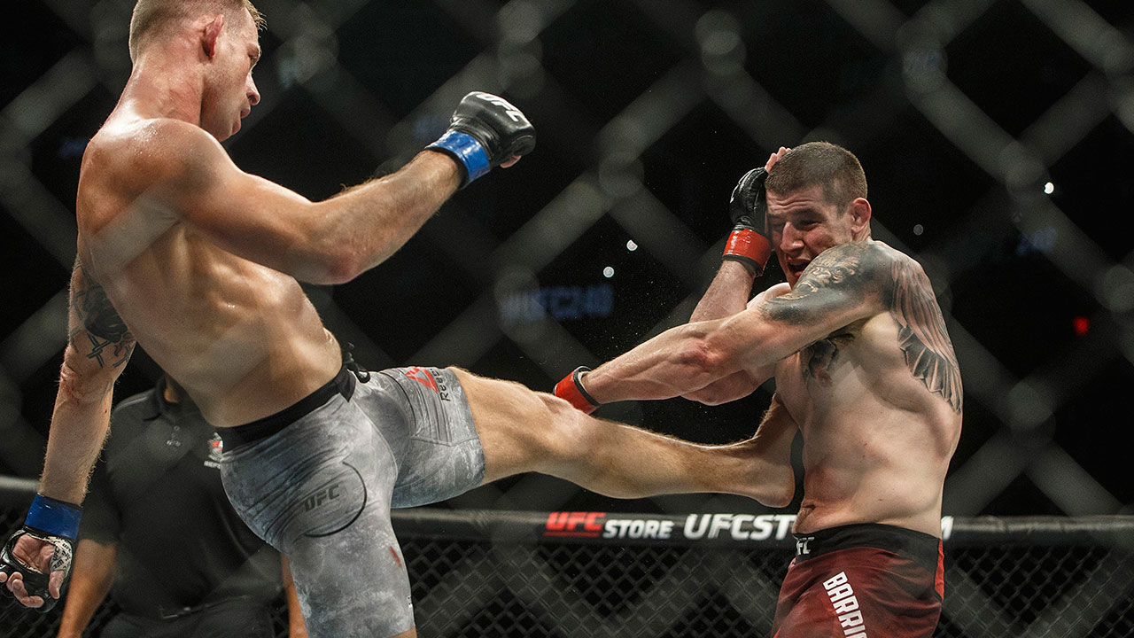 Marc-Andre-Barriault-is-kicked-by-Krzysztof-Jotko-at-UFC-240