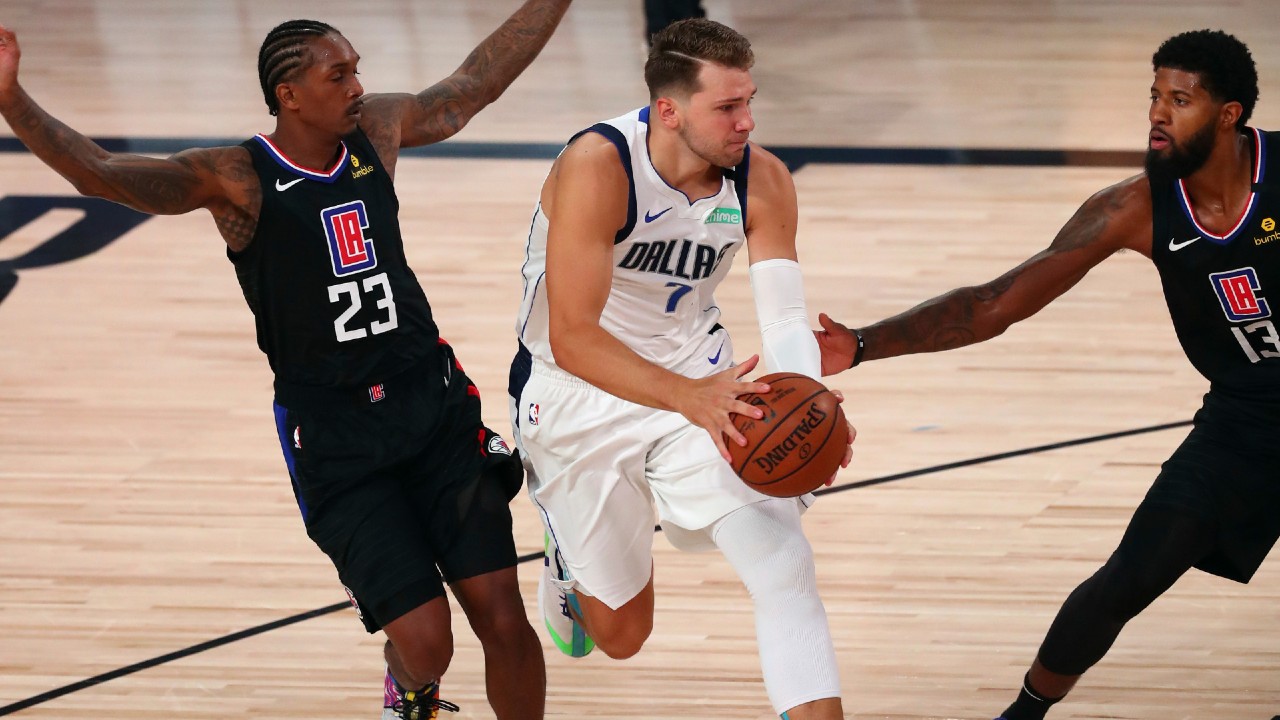 Boban Marjanovic and Luka Doncic of the Dallas Mavericks shake