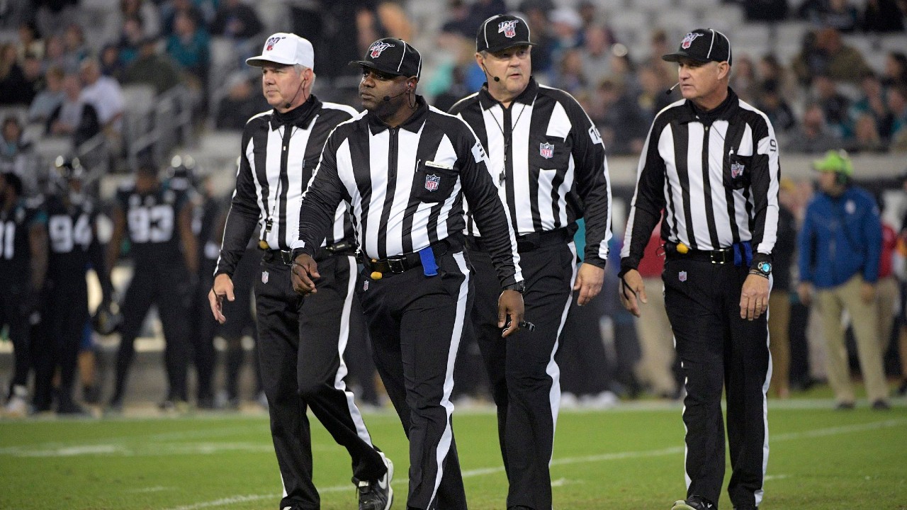 FILE - In this Dec. 8, 2019, file photo, referee Bill Vinovich, left, field judge Mearl Robinson (31), umpire Bruce Stritesky (102) and line judge Mark Perlman (9) walk to the sideline after a play during the second half of an NFL football game. (Phelan M. Ebenhack/AP)