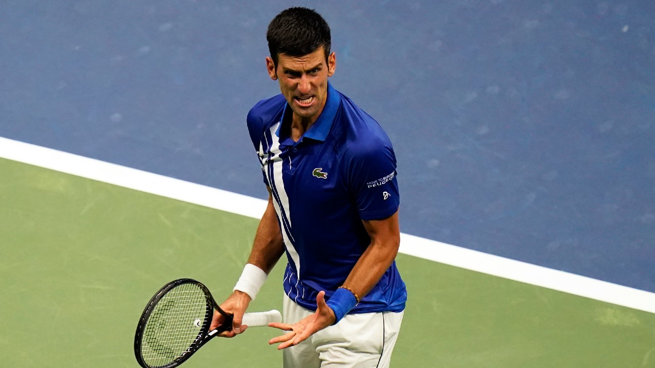 Novak Djokovic reacts after a winning a set against Damir Dzumhur during the first round of the U.S. Open. (Frank Franklin II/AP)
