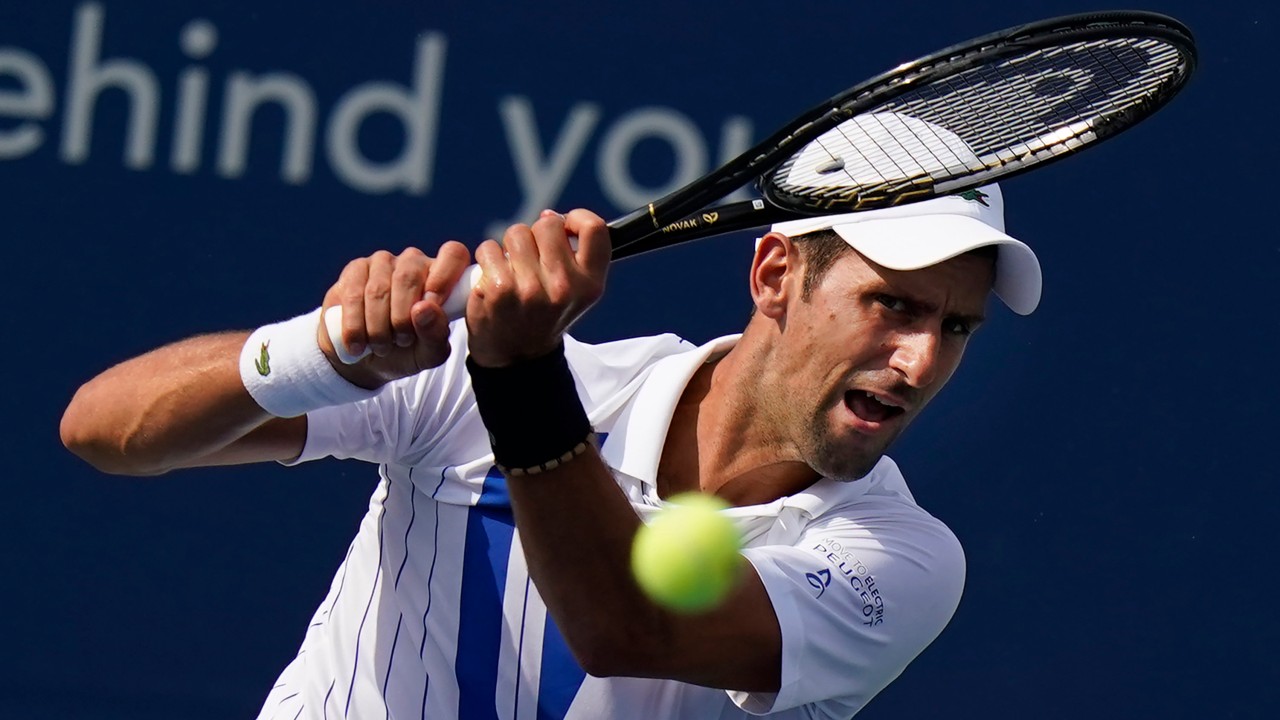 Novak Djokovic, of Serbia, returns a shot. (Frank Franklin II/AP)