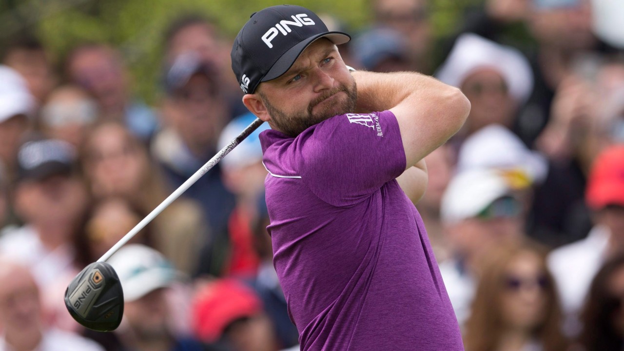 Andy Sullivan of England tees off. (Paul White/AP)
