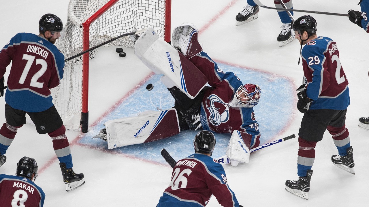 Colorado Avalanche goalie Michael Hutchinson (35) makes the save as him and teammates warm up before first period NHL Western Conference Stanley Cup playoff action against the Dallas Stars, in Edmonton on Monday, Aug. 24, 2020. (Jason Franson/CP)