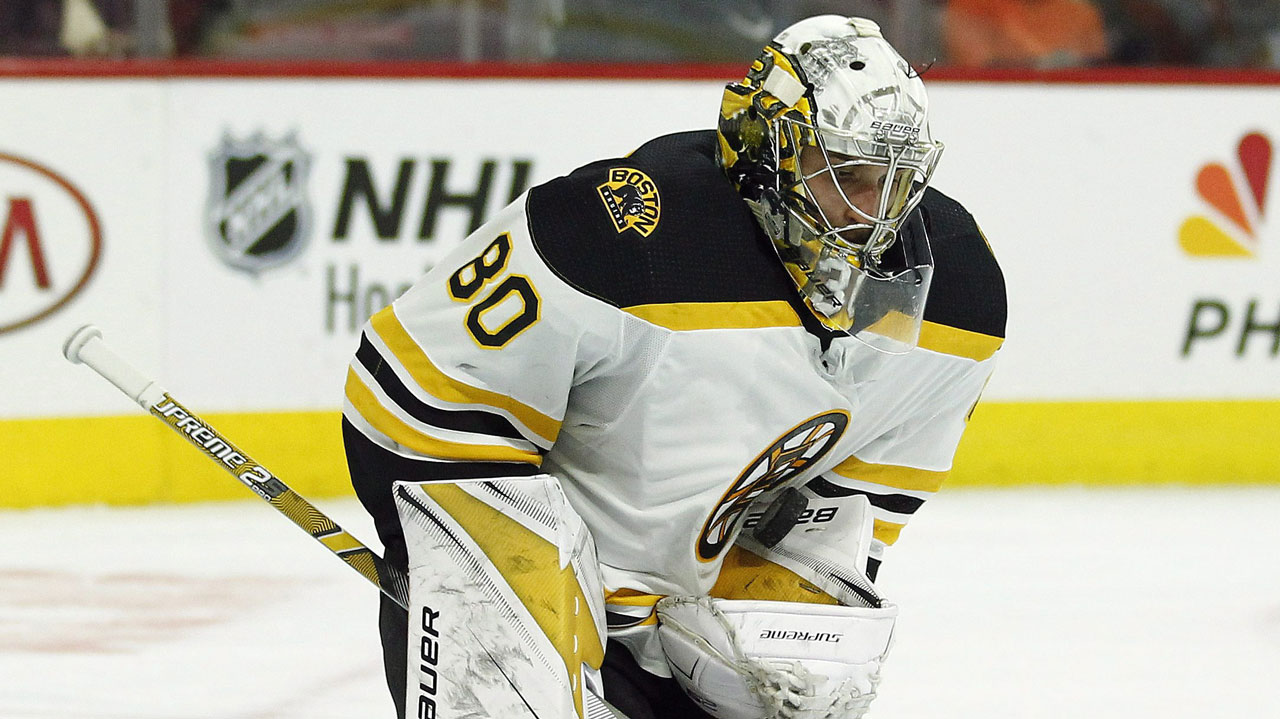 Boston Bruins goalie Dan Vladar holds onto the puck. (Tom Mihalek/AP)