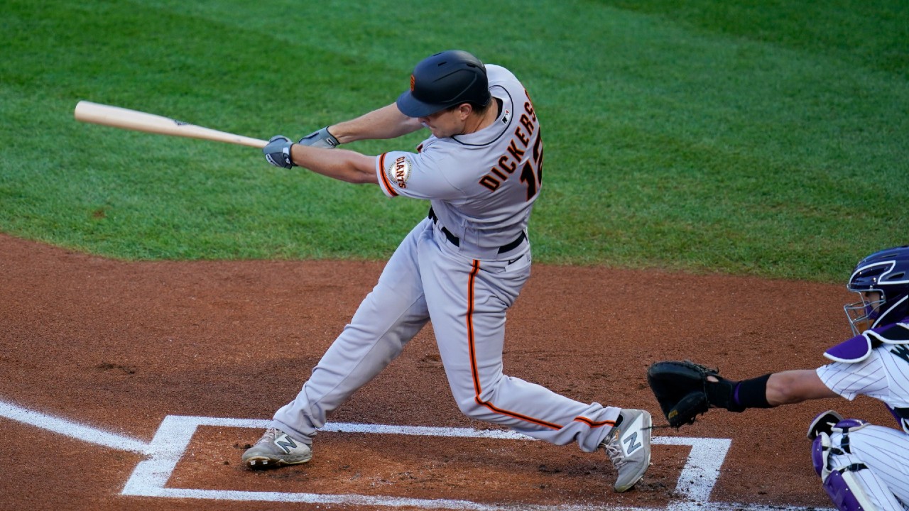 San Francisco Giants outfielder Alex Dickerson connects for a solo home run off Colorado Rockies starting pitcher Jon Gray. (David Zalubowski/AP)