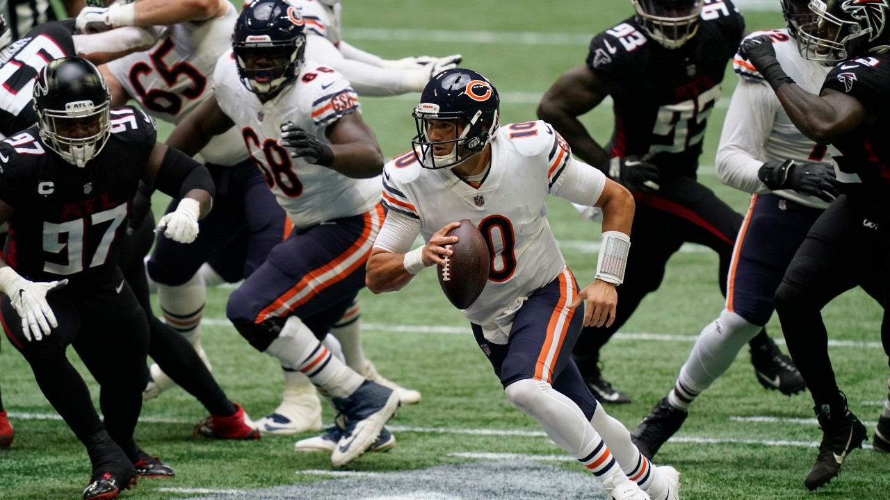 Chicago Bears quarterback Mitchell Trubisky (10) runs out of the pocket against the Atlanta Falcons during the first half of an NFL football game. (Brynn Anderson/AP)