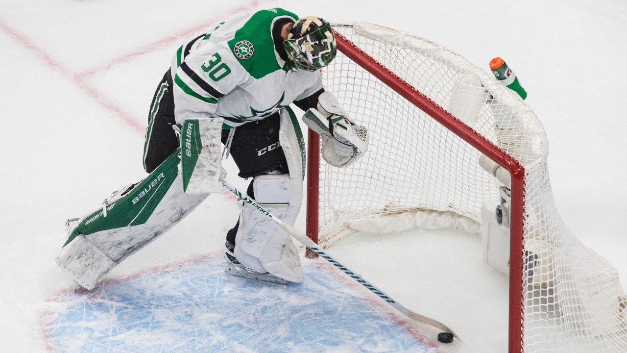 Dallas Stars goalie Ben Bishop (30) picks the puck out of the net after being scored on by the Colorado Avalanche. (Jason Franson/CP)