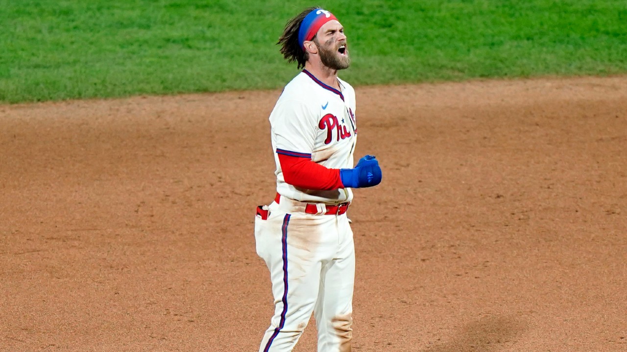 Philadelphia Phillies' Bryce Harper reacts after hitting a two-run double off Toronto Blue Jays pitcher Rafael Dolis during the sixth inning of the second baseball game in a doubleheader, Friday, Sept. 18, 2020, in Philadelphia. (Matt Slocum/AP)