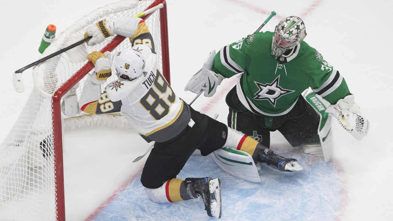 Dallas Stars goalie Anton Khudobin (35) watches as Vegas Golden Knights' Alex Tuch (89) crashes into the net during second period NHL Western Conference final playoff action in Edmonton on Saturday, September 12, 2020. (Jason Franson/CP)