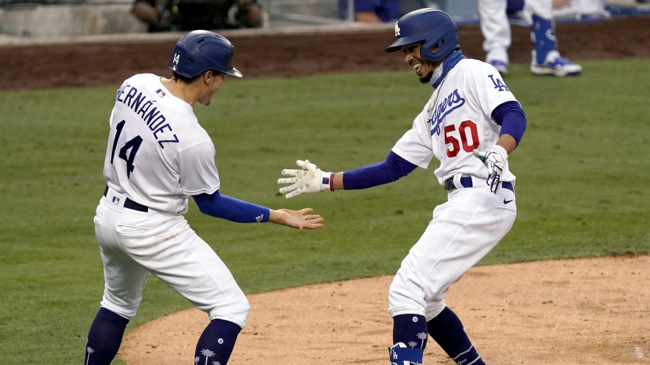Los Angeles Dodgers' Mookie Betts, right, gets congratulations from Enrique Hernandez. (Alex Gallardo/AP)