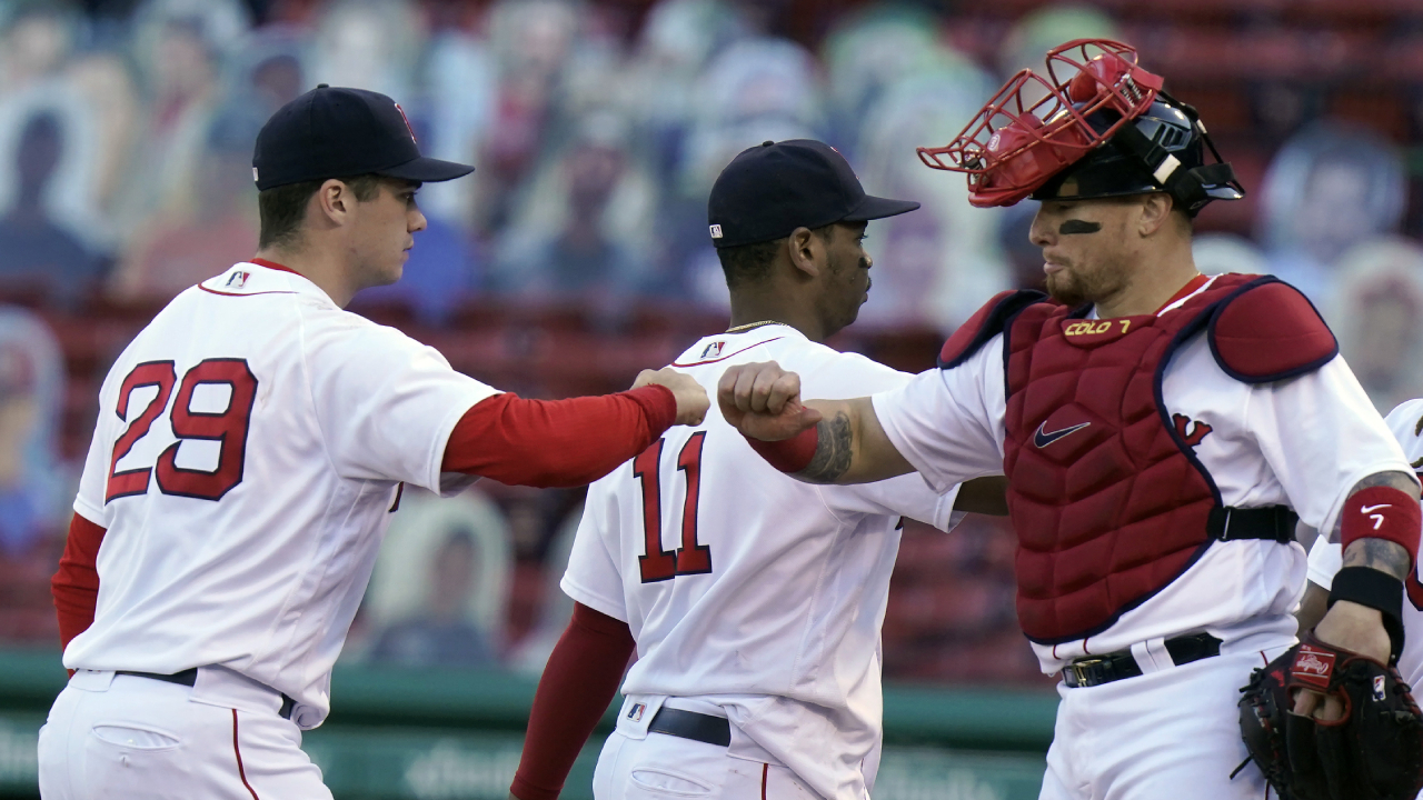 Boston Red Sox's Bobby Dalbec, left, Rafael Devers, center, and Christian Vazquez, right, celebrate after beating the New York Yankees in a baseball game, Sunday, Sept. 20, 2020, in Boston. (Steven Senn/AP)