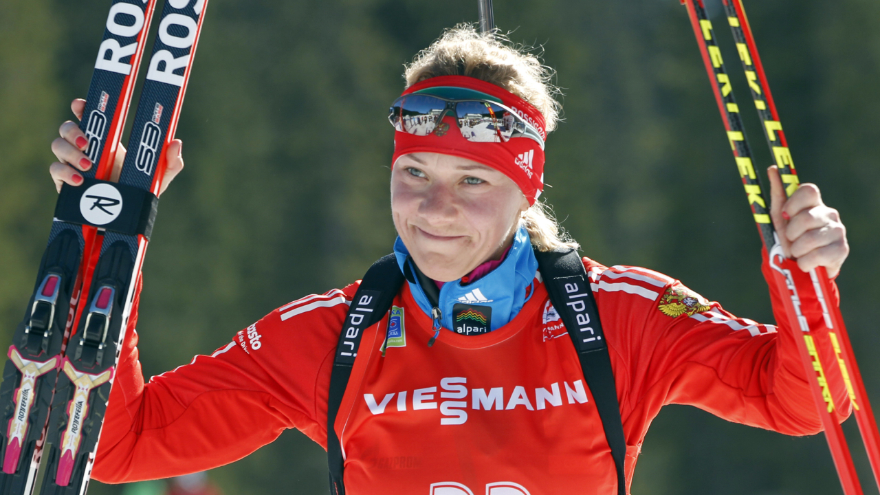 FILE - In this Sunday, March 9, 2014 file photo, Russia's Olga Zaitseva celebrates her third place in the women's 12.5km mass start at the biathlon World Cup competition in Pokljuka, Slovenia. Two-time Olympic biathlon champion Olga Zaitseva lost her appeal Thursday Sept. 24, 2020, against disqualification from the 2014 Sochi Olympics for her part in Russia’s state-backed doping program. (Darko Bandic/AP)