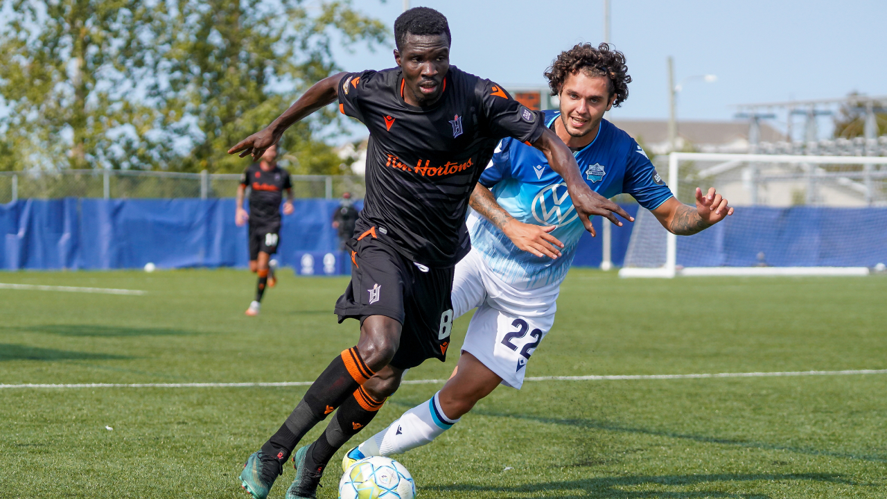 Forge FC's Elimane Cisse and HFX Wanderers' Joao Morelli. (Canadian Premier League/Chant Photography)